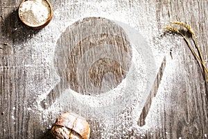 Flour powder and bakery on wooden table