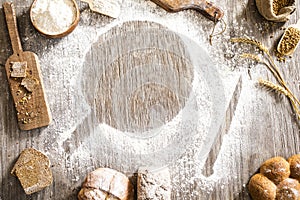 Flour powder and bakery on wooden table