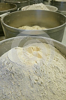 Flour prepared for making bread dough and baking bread in a bakery.