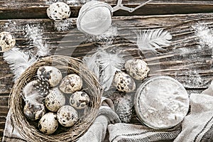 Flour and quail eggs. Ingredients for cooking. Wooden table. To