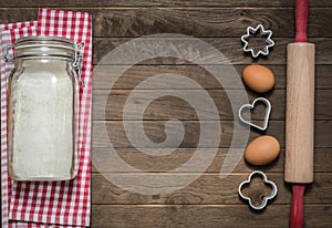 Flour, rolling pin, eggs and moulds