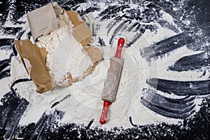 Flour and rolling pin for kneading the dough on the kitchen table. Accessories and kitchen products.