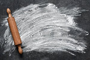 Flour and rolling pin on the table. The process of cooking tagliatelle pasta