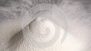 Flour is sifted through a sieve