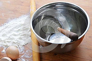 Flour on wooden background