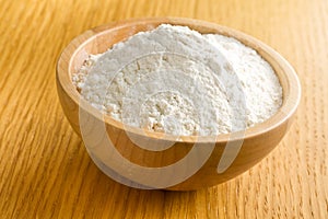 Flour in wooden bowl