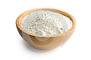 Flour in wooden bowl photo