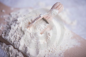 Flour on wooden cutting board