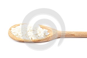 Flour in a wooden spoon on a white background.