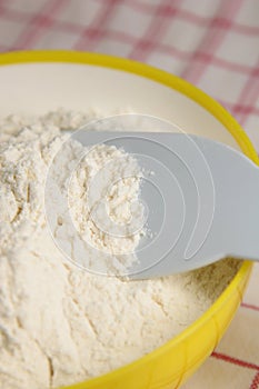 Flour in yellow bowl