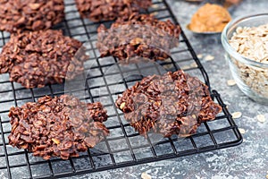 Flourless no bake peanut butter and oatmeal chocolate cookies on  cooling rack, horizontal