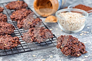 Flourless no bake peanut butter and oatmeal chocolate cookies on  cooling rack, horizontal photo