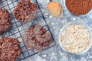 Flourless no bake peanut butter and oatmeal chocolate cookies on  cooling rack, horizontal, top view