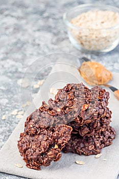 Flourless no bake peanut butter and oatmeal chocolate cookies, vertical, copy space
