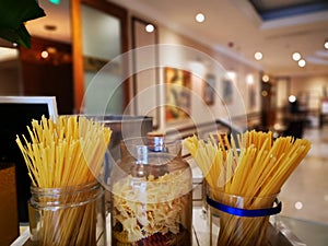 Floury pasta arrangement in glass jars