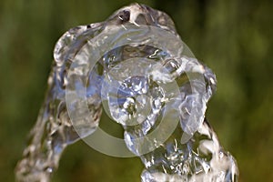 Flow of pure spring water on a natural background