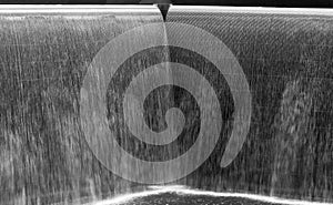 Flow of water in a big fountain, black and white