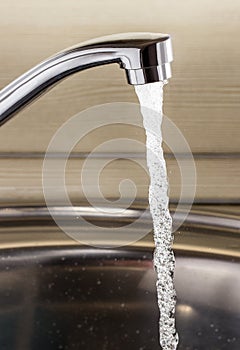 The flow of water from the tap