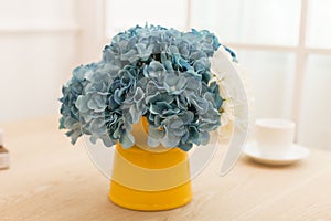 Flower Arrangement in bottle On table office desk