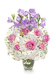 Flower arrangement bouquet of yarrow, blue bell and rose in a vase isolated on white background