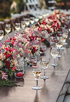 Flower arrangement and glassware photo