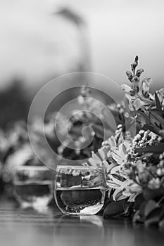 Flower arrangement and glassware photo