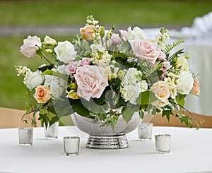 Flower arrangement in silver bowl photo