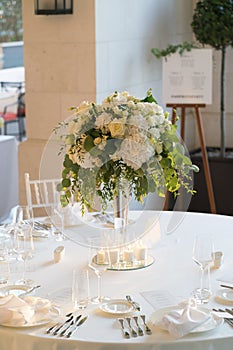 Flower arrangement on a table for a wedding dinner