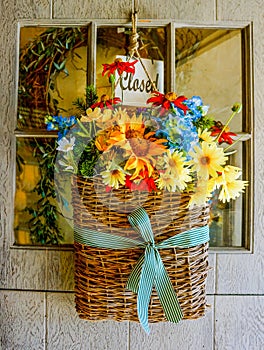Flower Basket on Retail Shop Door Closed Sign