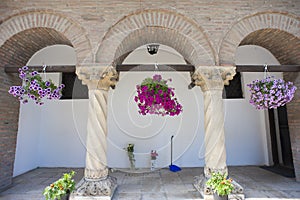 Flower baskets in archway