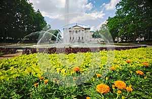 Flower beds, fountain and facade of the historic opera building