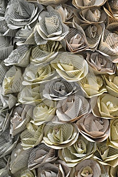 Flower blossoms folded from book pages