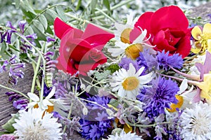 A flower bouquet with a lot of a different flowers