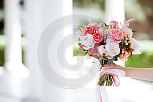 Flower bouquet in woman hand