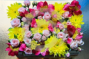 Flower box made of Yellow Chrysanthemums, Pink rose roses and Vivid Pink Alstroemerias
