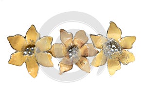Flower brooches on white