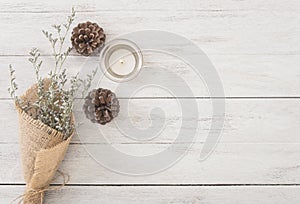 Flower and candle decoration on wood table with panel banner