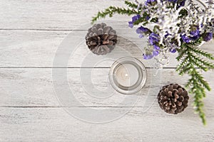 Flower and candle decoration on wood table with panel banner