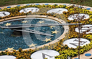 Flower clock with figures and stars
