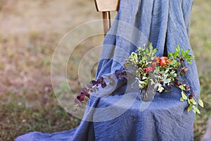 Flower composition on the chair decorated with texstile