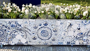 Flower container in artistic composition with dutch tiles