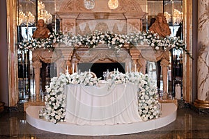 Flower decoration of wedding tables. Banquet table setting and decoration