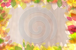 Flower frame template. Abstract fall colors background texture with a frame of colorful leaves with space for greetings, lettering