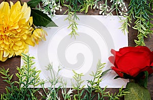 Flower frame with white Blank Paper on Wood Background