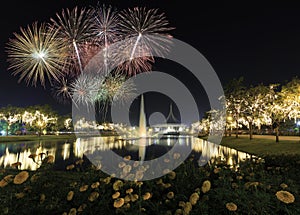 A flower garden with Beautiful Fireworks for celebration at twilight time in Bangkok, Thailand