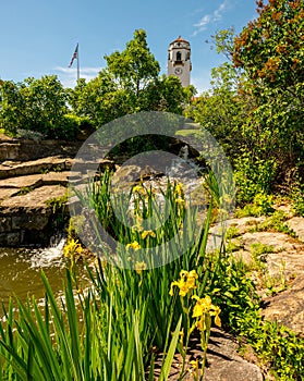 Flower garden at a local city park with waterfall and Depot