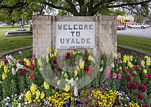 Flower Garden and Welcome to Uvalde sign at the corner of 4th Street and US Highway 90 in Uvalde, Texas.