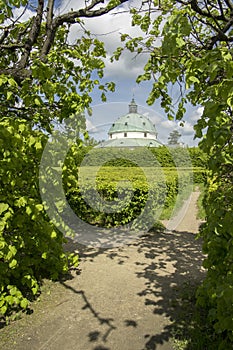 Flower gardens in french style and rotunda building in Kromeriz, Czech republic, Europe