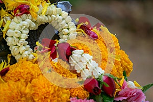 Flower garland comprise of jasmines, roses, gardenias and ervatamias on the Buddha image