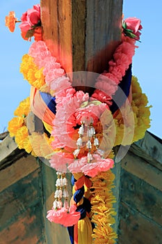Flower garland on a long-tail boat on a beach of Ko Phi Phi Don, Phi Phi Islands, Thailand
